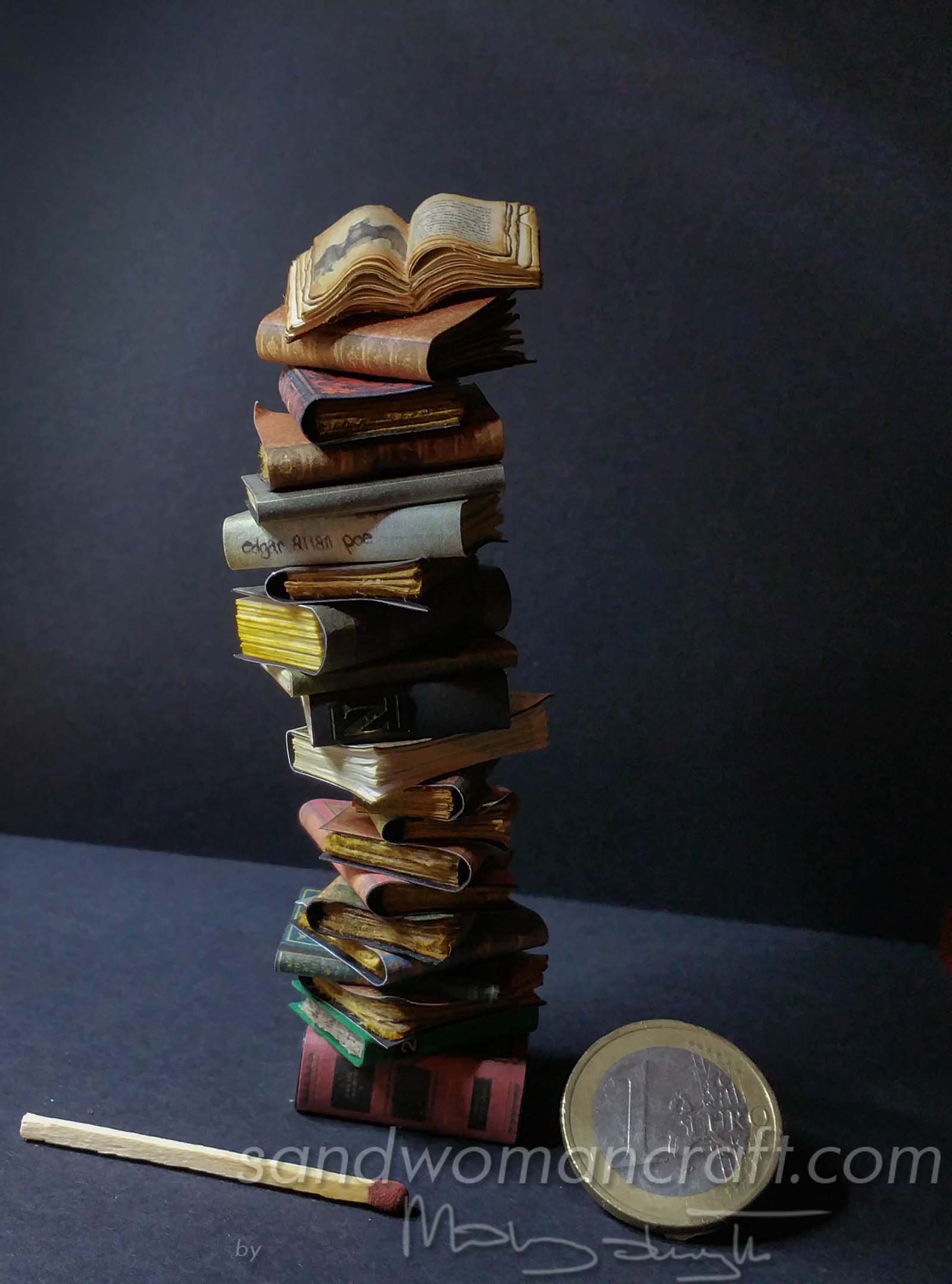 Miniature book stack with open bat book