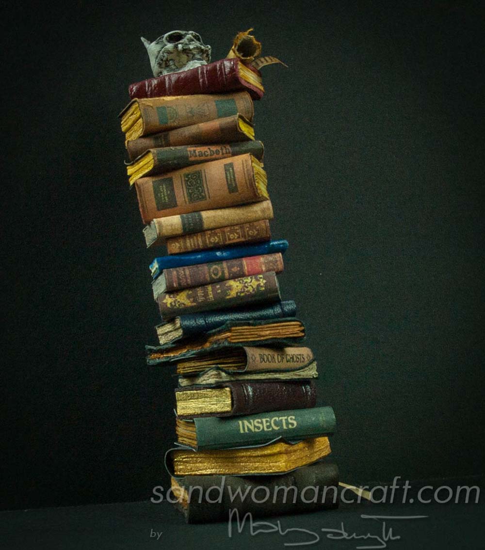 Miniature book stack with Devil's skull