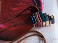 Miniature leather book necklace with charm made out of eight books