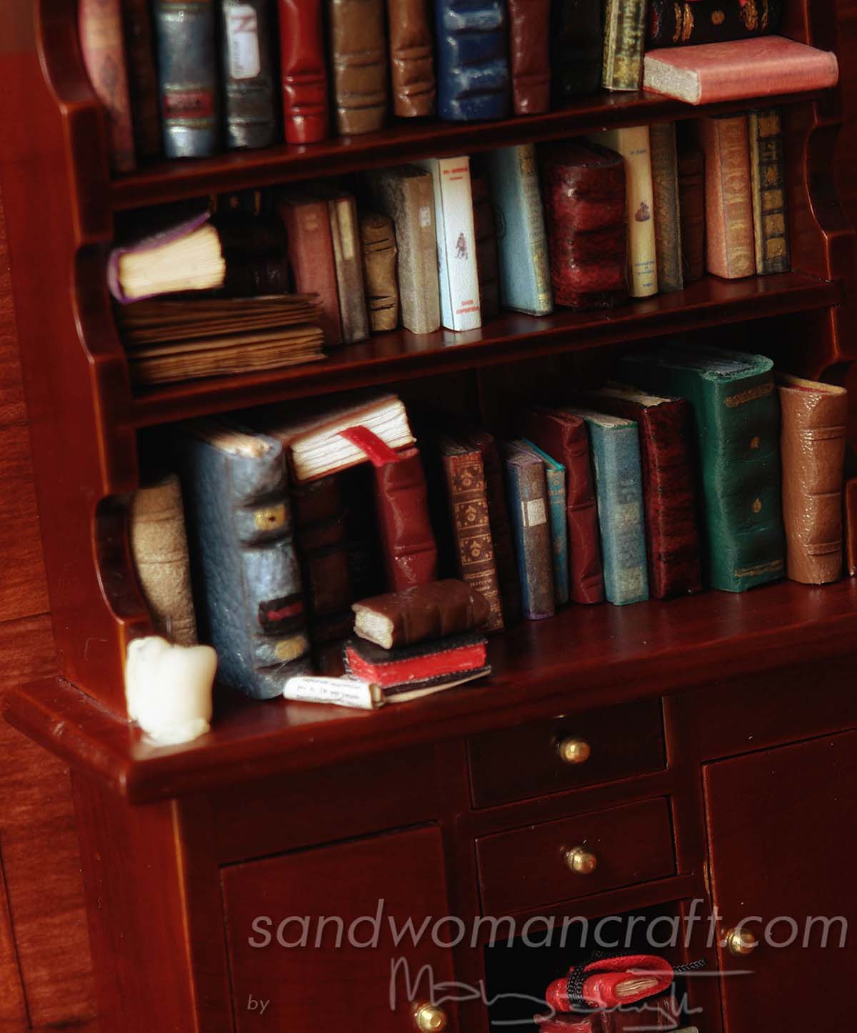 Bookcase with miniature books in 1:12 scale (1 inch scale). My private collection.
