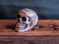 Miniature celtic skull, candles, book, lamp