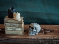 Miniature celtic skull, candles, books