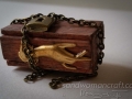 Miniature chest box with brass hand ornament
