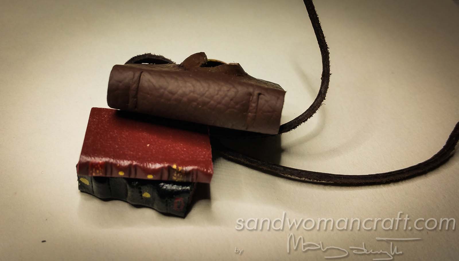 Miniature leather book with glass dragon's eye