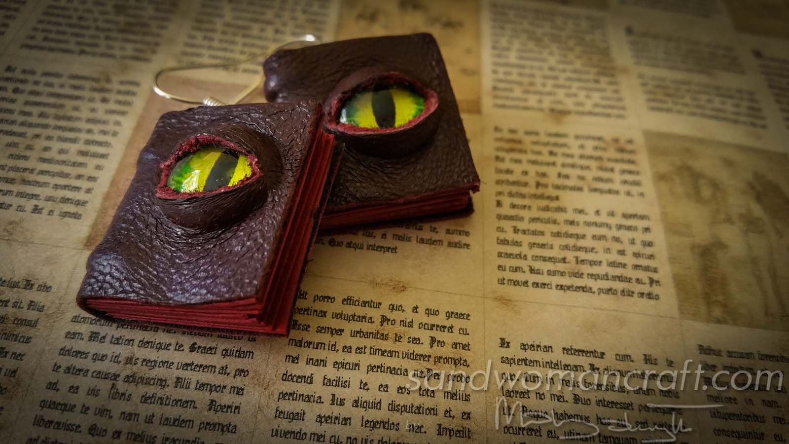 Miniature leather book earrings with glass dragon's eye cover