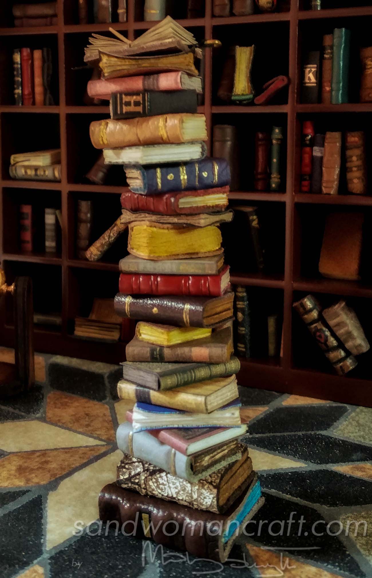 Miniature book stack with Leonardo Da Vinci open book