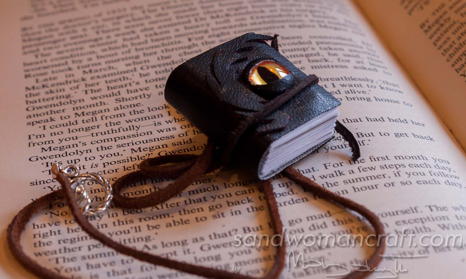 Miniature leather book necklace with real book to read inside. Da Vinci theme
