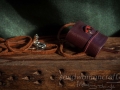 Miniature leather book necklace with real medieval theme book inside