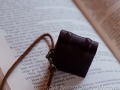 Miniature leather book necklace with Dragon's Eye