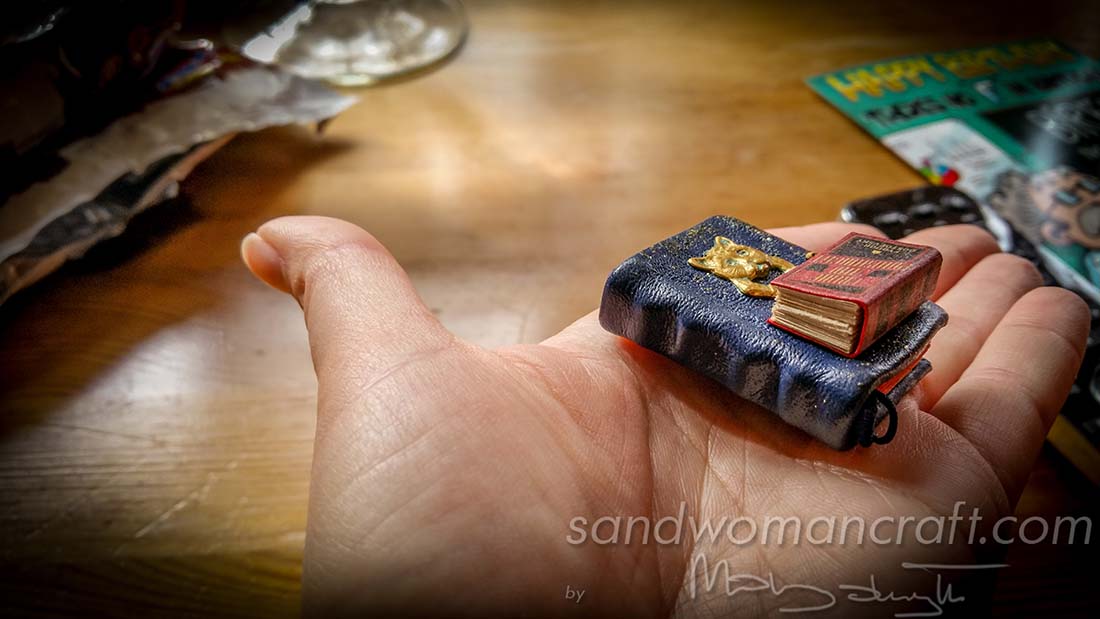 Miniature books.  Blue leather with brass cat and Dostoyevsky's "Crime and Punishment"