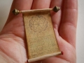 Miniature scroll on aged paper